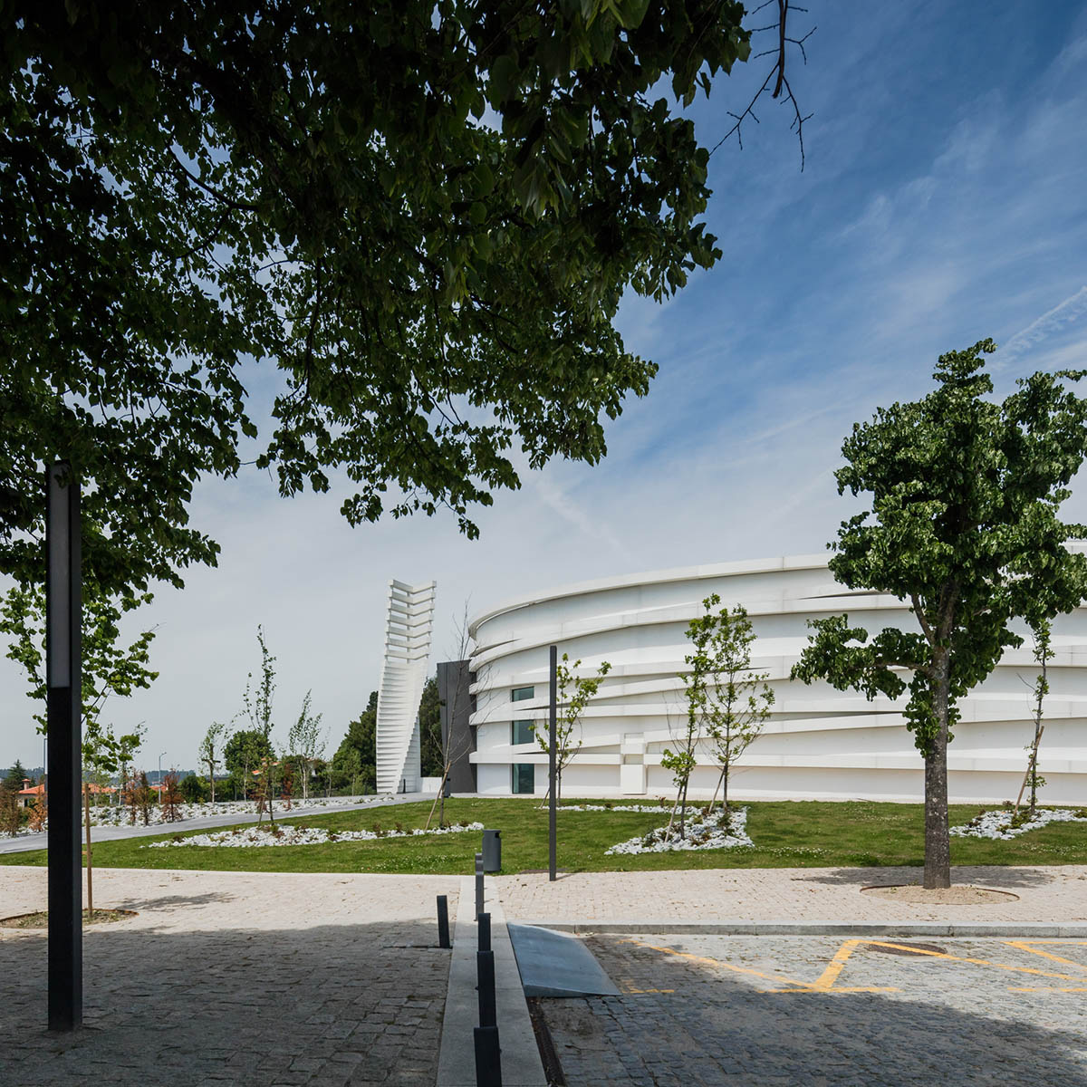 Hugo Correia Completes Elliptical Church Featuring Sharp Concrete Lines In Portugal