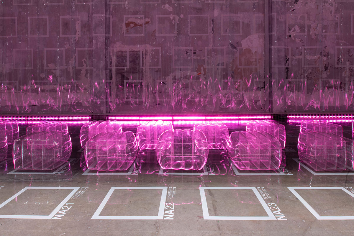 AMO Filled Prada's Fashion Show Stage With Purple-Lit Inflatable Stools