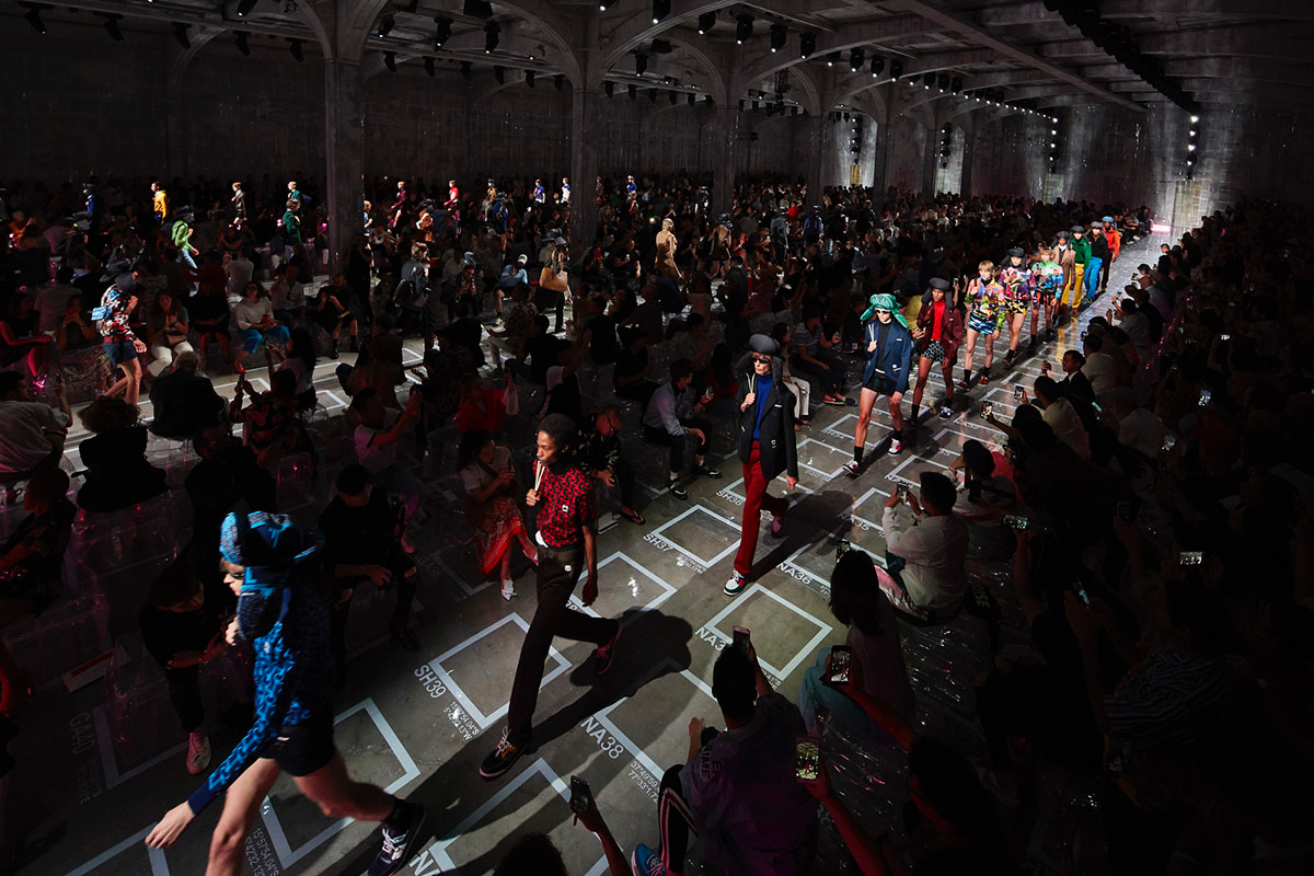 AMO Filled Prada's Fashion Show Stage With Purple-Lit Inflatable Stools