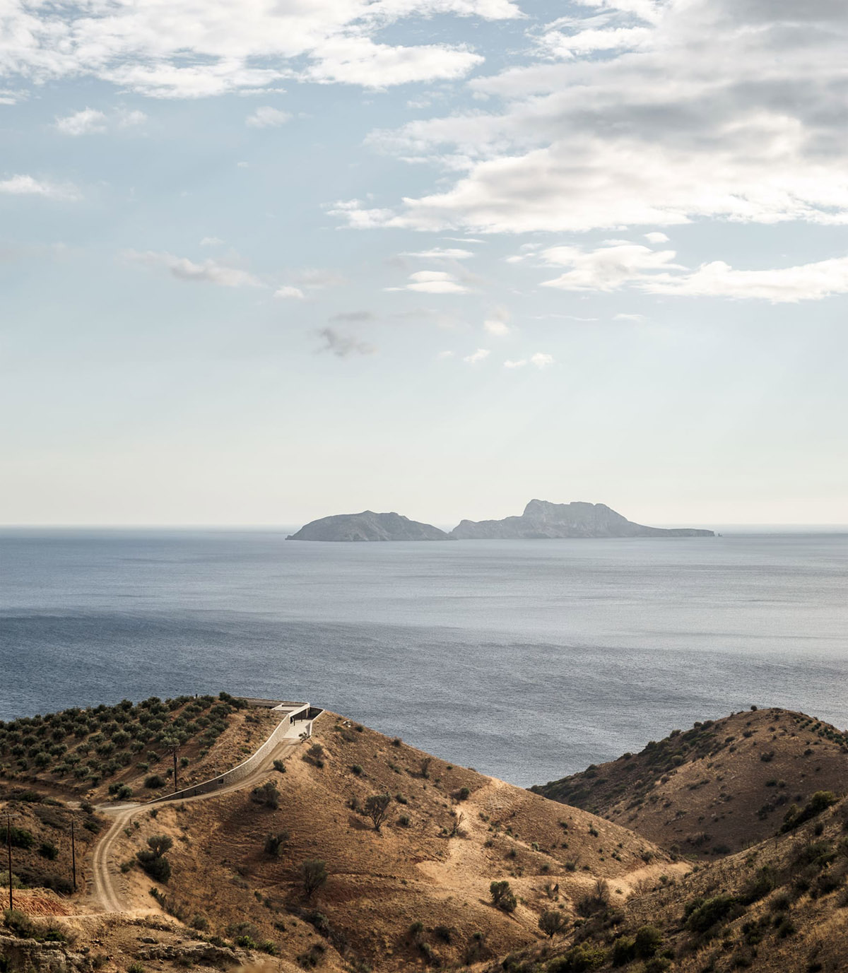 DecaACHITECTURE Completes Ring House On Top Of Deserted Landscape Of Crete