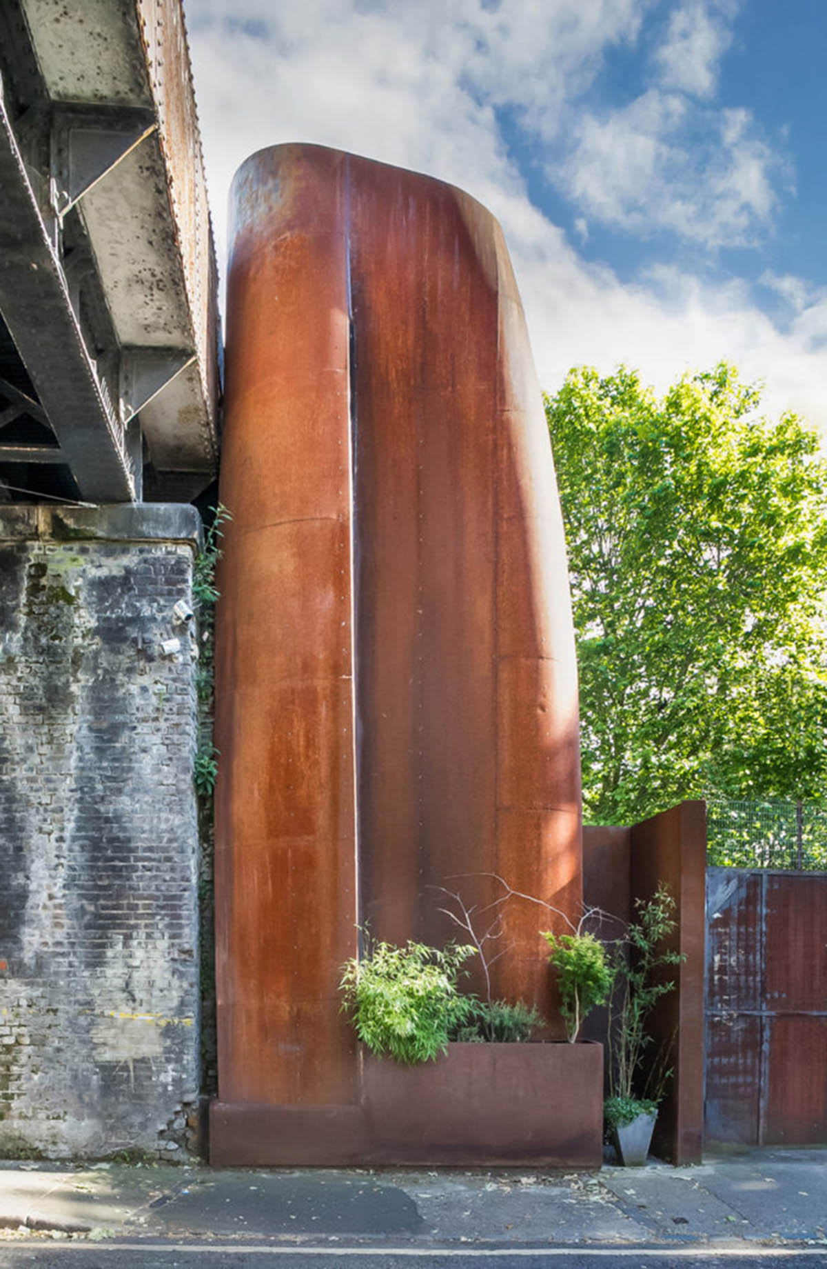 Undercurrent Architects' Live-Workspace Building Dominates City With Industrial Steel Exterior