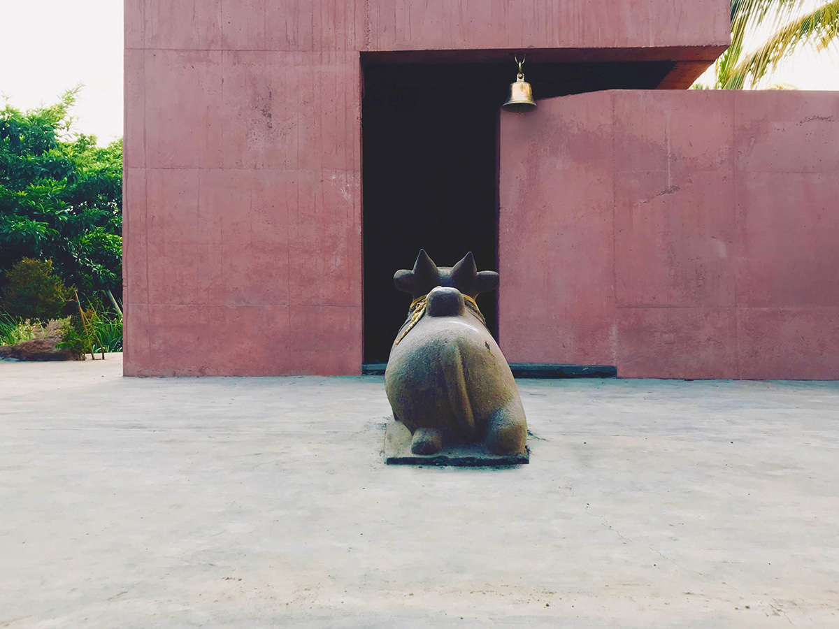 Karan Darda Architects Built A Sculptural Temple With Reddish-Colored Concrete Walls In Pune