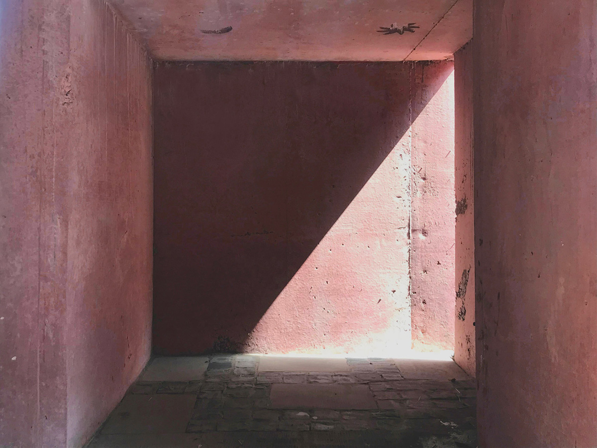 Karan Darda Architects Built A Sculptural Temple With Reddish-Colored Concrete Walls In Pune
