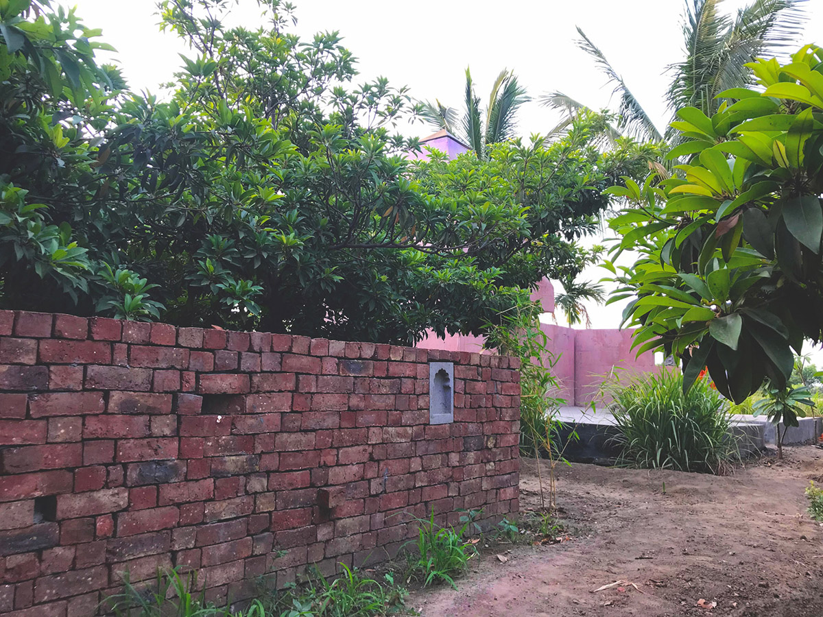 Karan Darda Architects Built A Sculptural Temple With Reddish-Colored Concrete Walls In Pune
