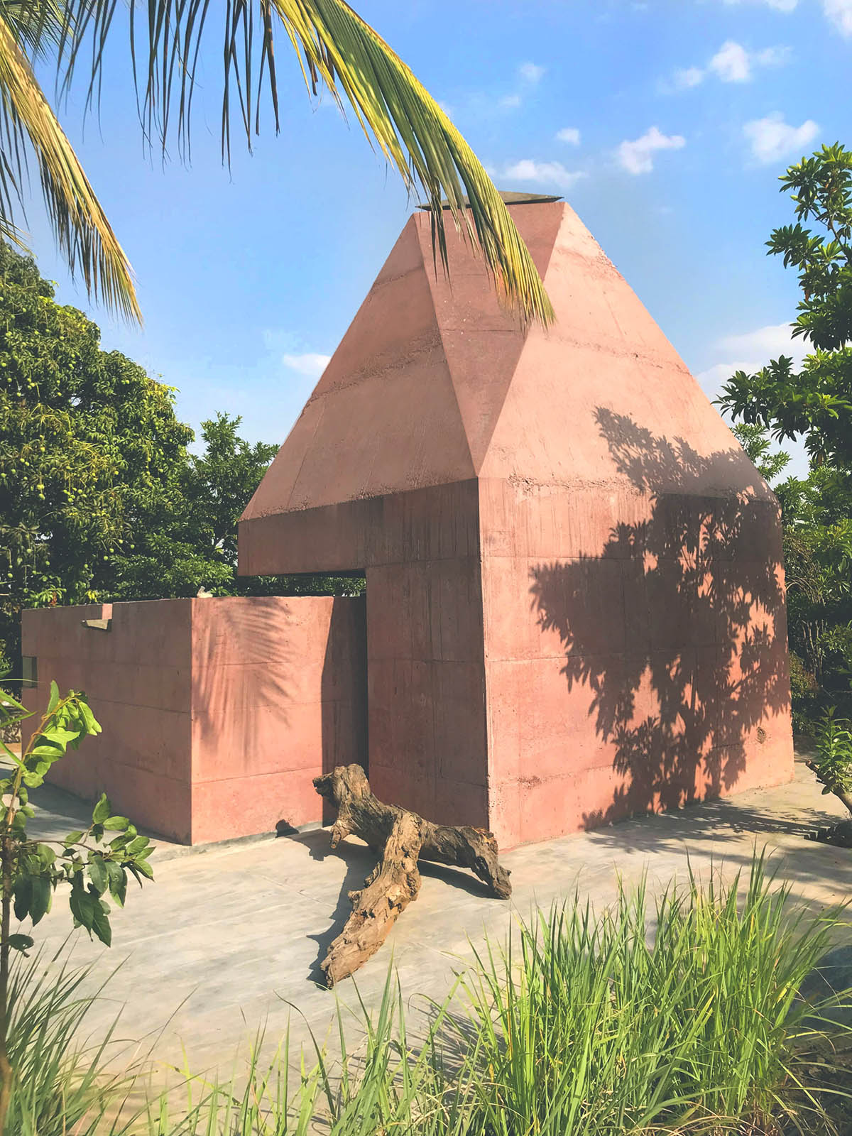 Karan Darda Architects Built A Sculptural Temple With Reddish-Colored Concrete Walls In Pune