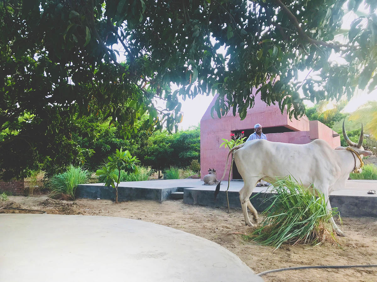 Karan Darda Architects Built A Sculptural Temple With Reddish-Colored Concrete Walls In Pune