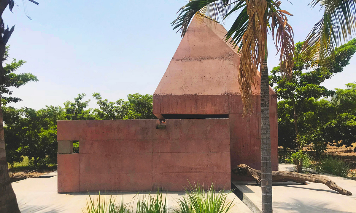 Karan Darda Architects Built A Sculptural Temple With Reddish-Colored Concrete Walls In Pune
