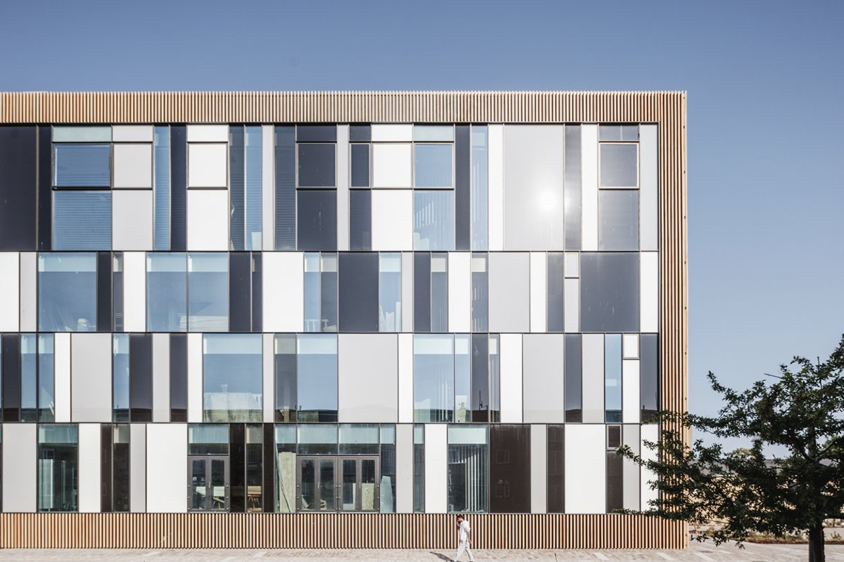 COBE's Funnel-Shaped Tingbjerg Library And Culture House Acts Like A Single Facade In Copenhagen