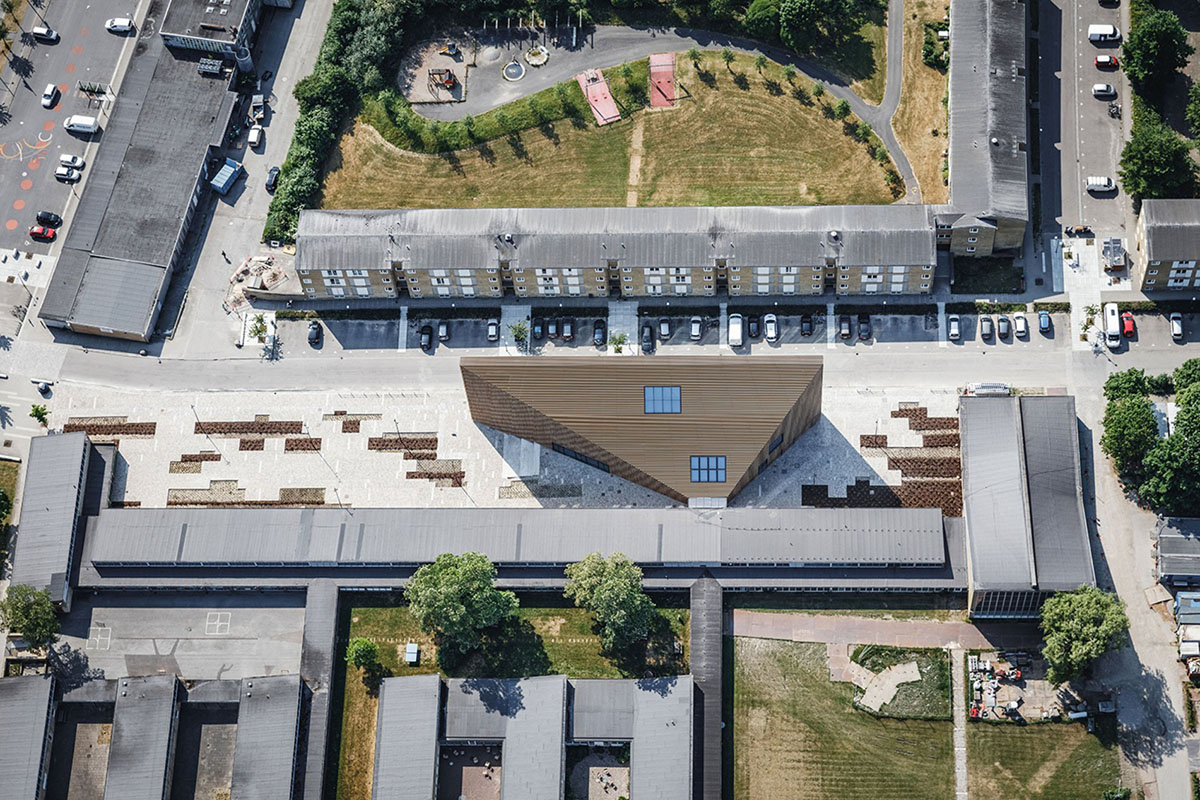 COBE's Funnel-Shaped Tingbjerg Library And Culture House Acts Like A Single Facade In Copenhagen