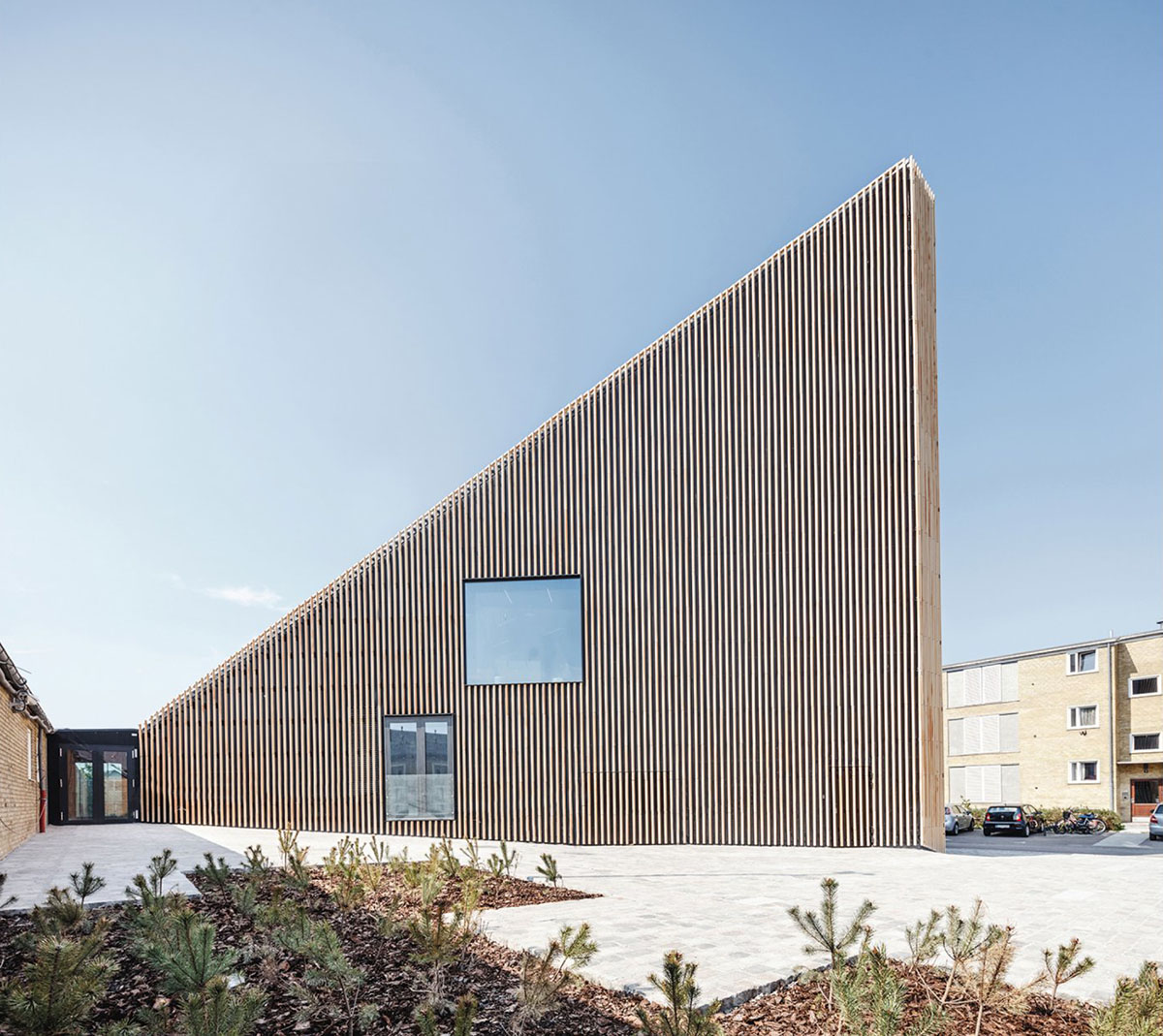 COBE's Funnel-Shaped Tingbjerg Library And Culture House Acts Like A Single Facade In Copenhagen