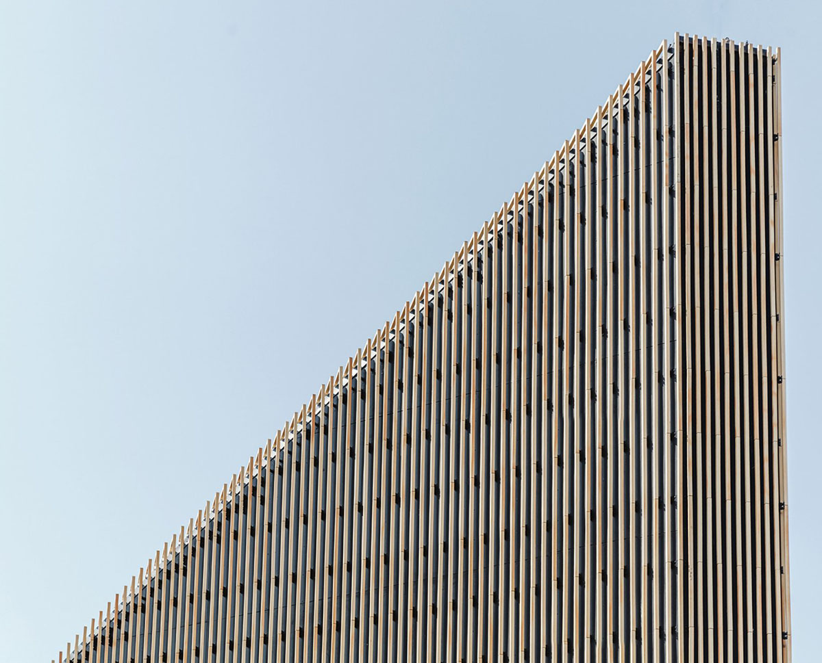 COBE's Funnel-Shaped Tingbjerg Library And Culture House Acts Like A Single Facade In Copenhagen