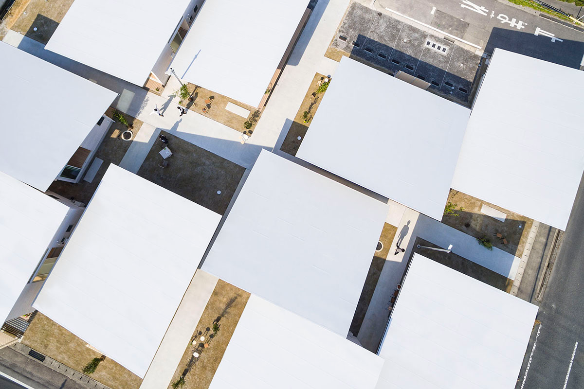 Studio Velocity Transforms 1950s Stacked Housing Complex Into Flat Wooden Apartments In Japan