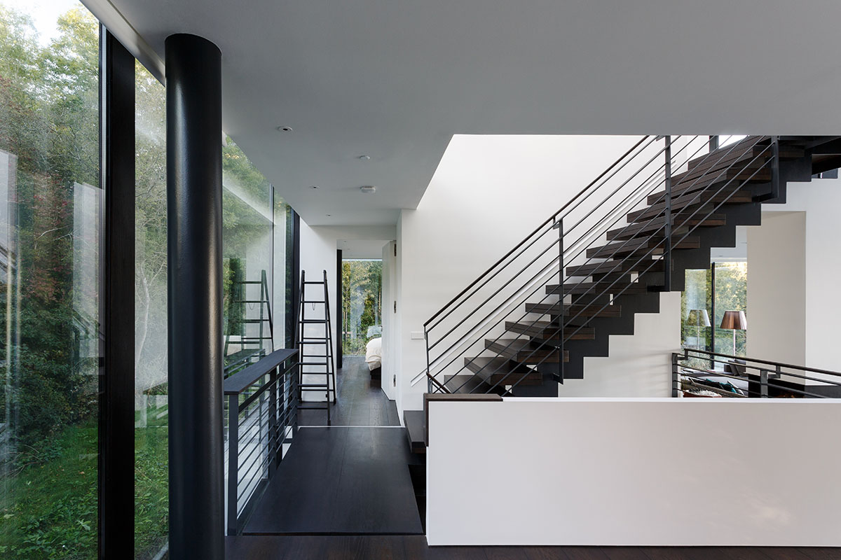 Mecanoo Completes Glass Villa With Dark Stripes On A Lake In Lechlade