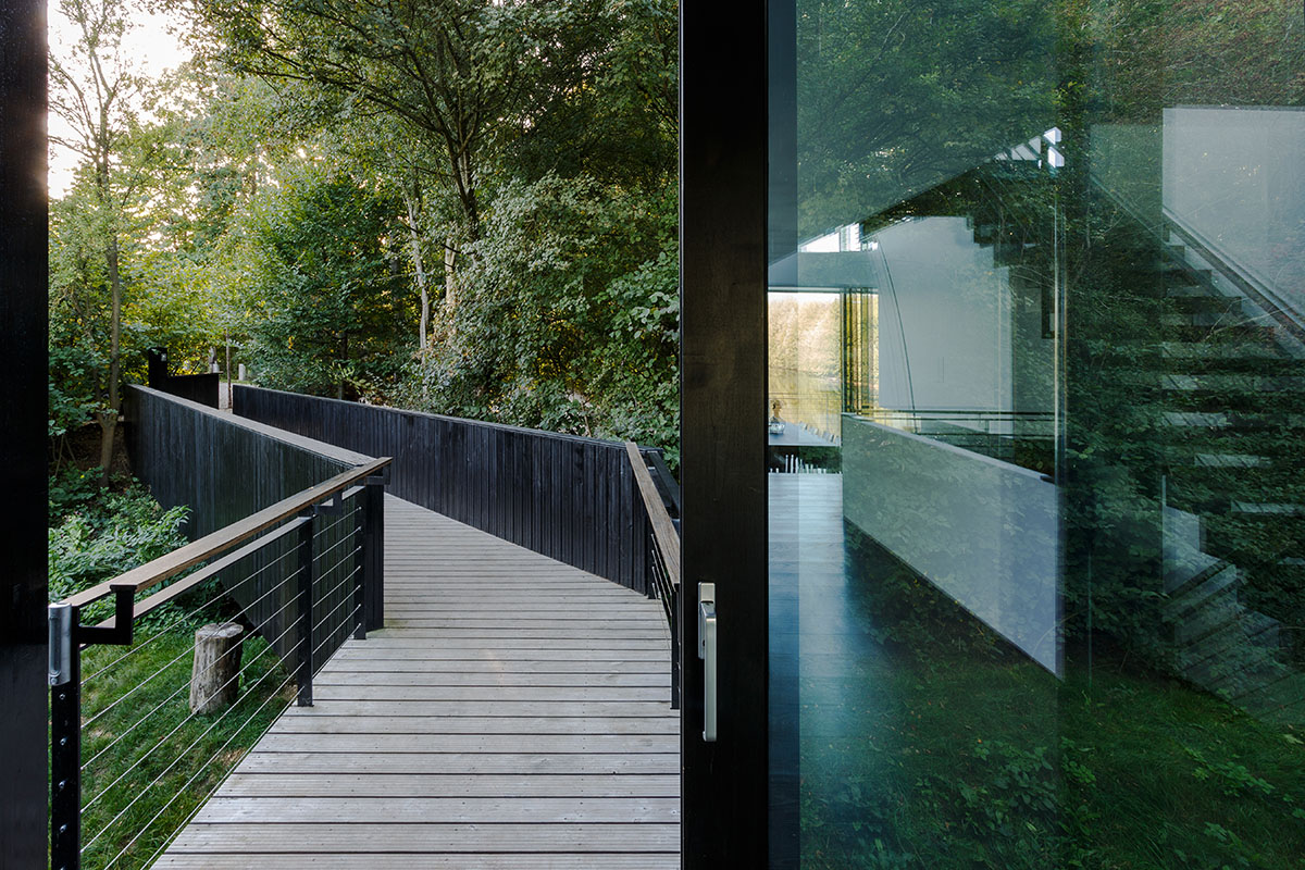 Mecanoo Completes Glass Villa With Dark Stripes On A Lake In Lechlade