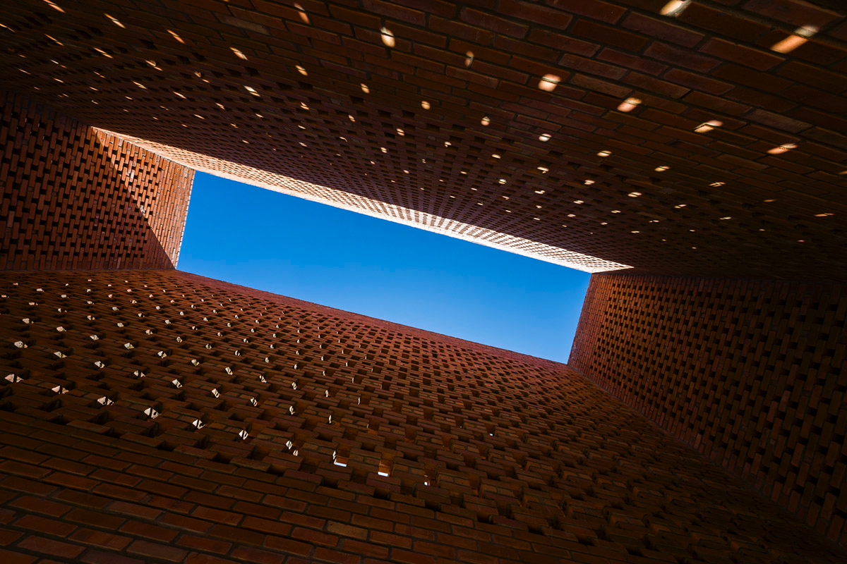 This Innovative Brick House In Vietnam Creates Continuous Internal Spaces
