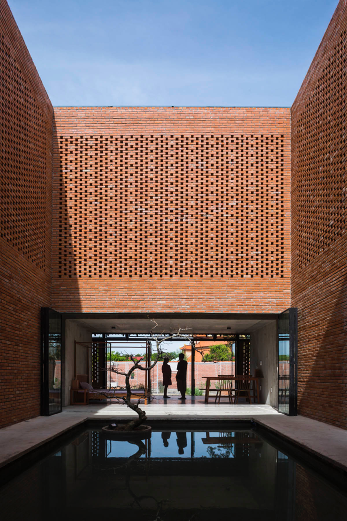 This Innovative Brick House In Vietnam Creates Continuous Internal Spaces