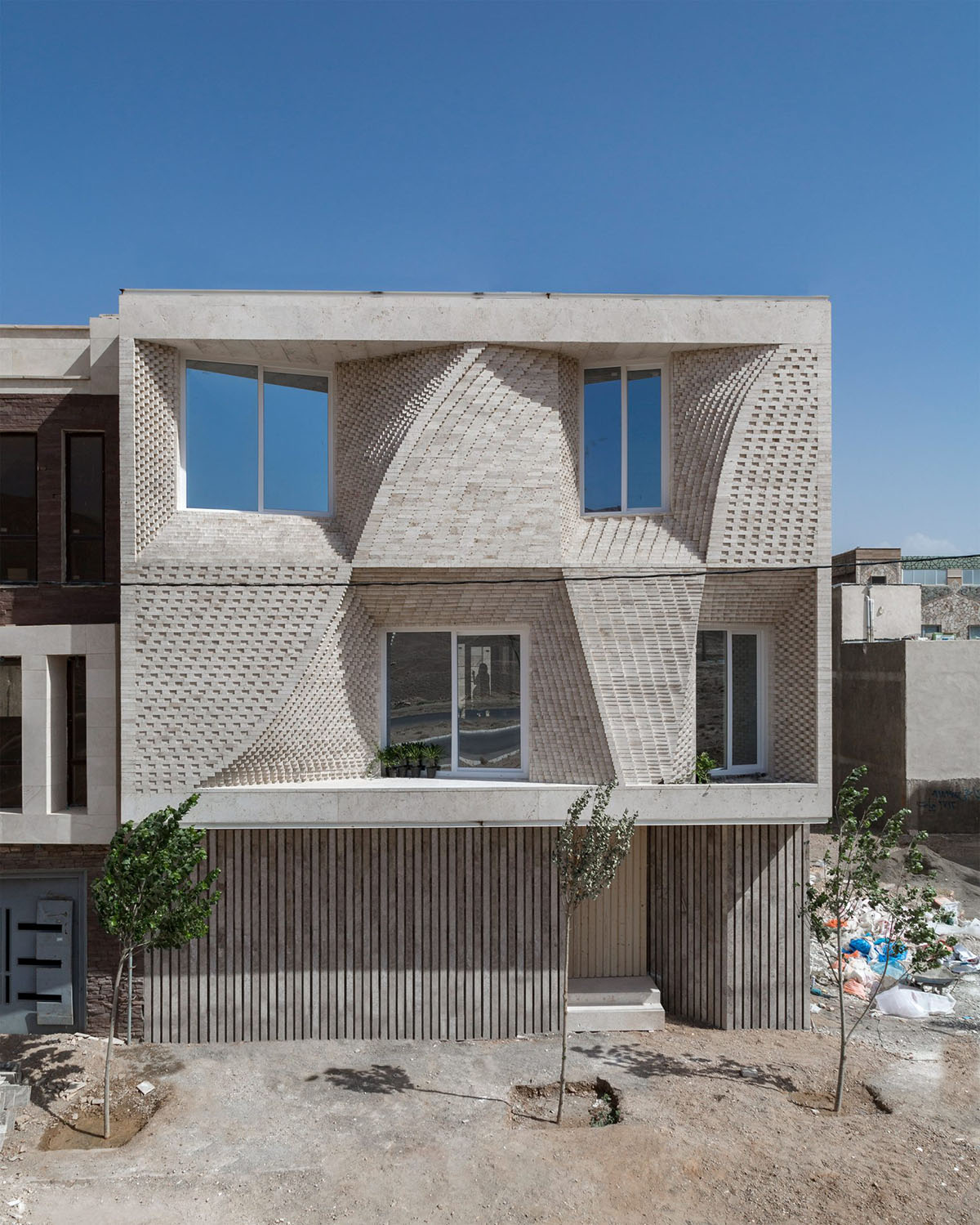 CAAT Studio Creates Spatial Variations Of Stone On The Facade Of This Iranian Residential Building