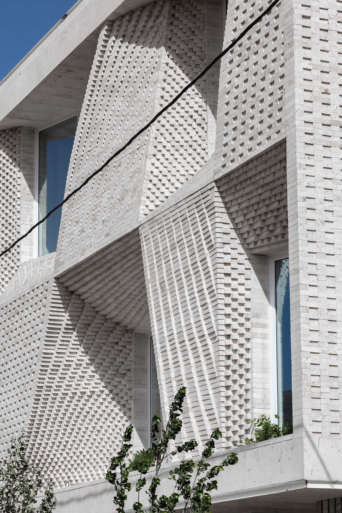 CAAT Studio Creates Spatial Variations Of Stone On The Facade Of This Iranian Residential Building