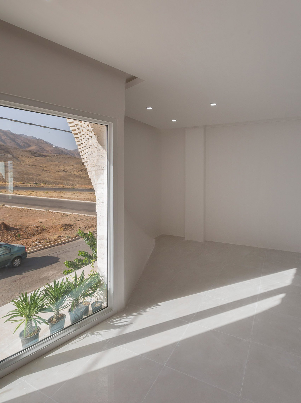 CAAT Studio Creates Spatial Variations Of Stone On The Facade Of This Iranian Residential Building