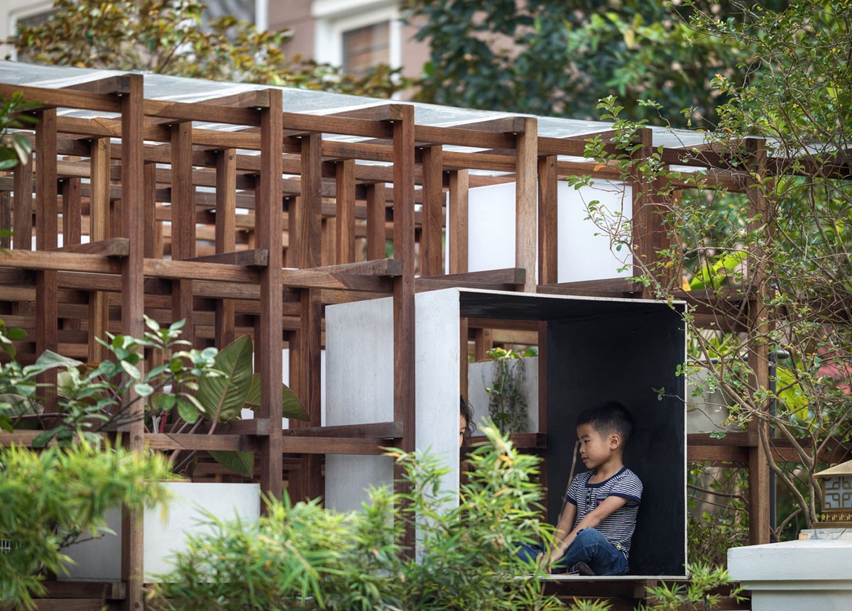 Farming Architects' Wooden Skeleton Provides Library Space For Children And Cage For Chickens