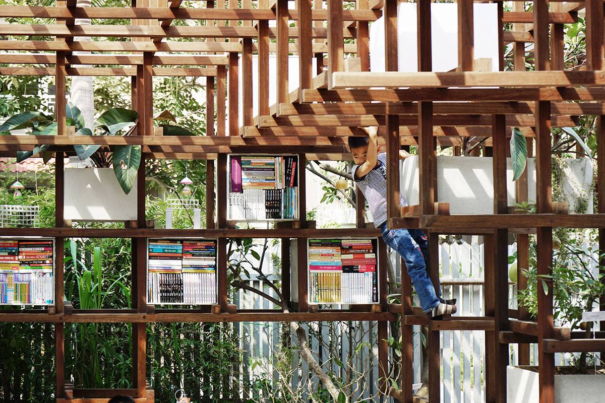Farming Architects' Wooden Skeleton Provides Library Space For Children And Cage For Chickens