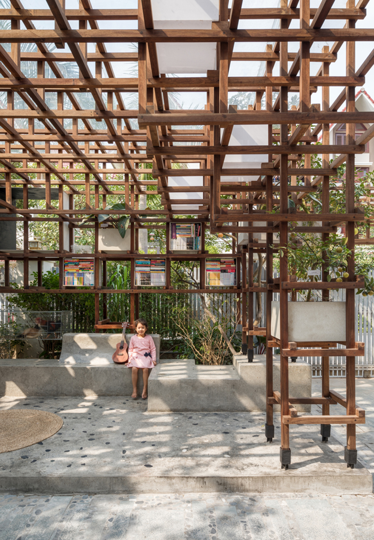 Farming Architects' Wooden Skeleton Provides Library Space For Children And Cage For Chickens