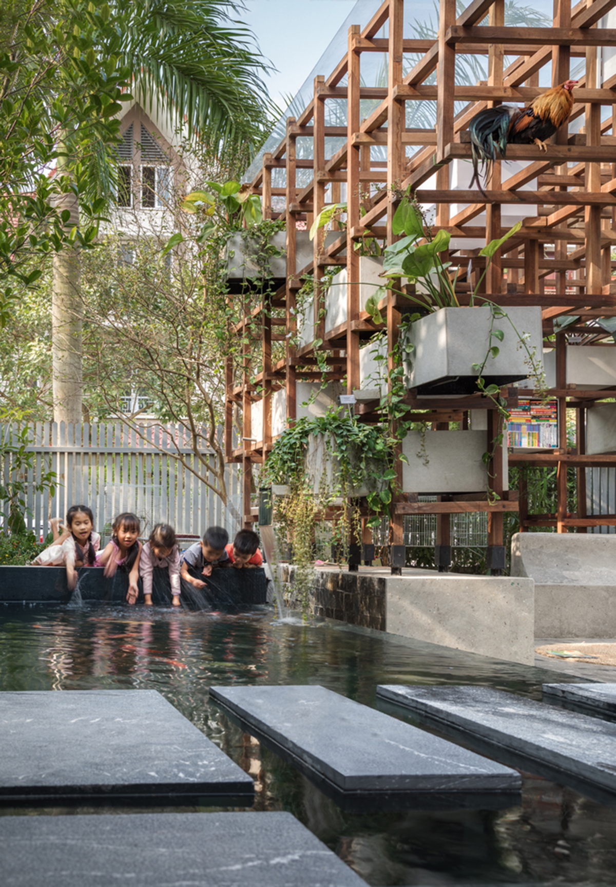 Farming Architects' Wooden Skeleton Provides Library Space For Children And Cage For Chickens