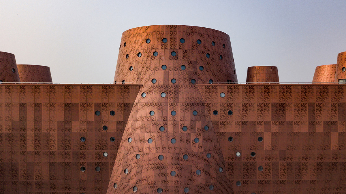 Bernard Tschumi's Exploratorium features copper-clad cones addressing Tianjin's industrial past