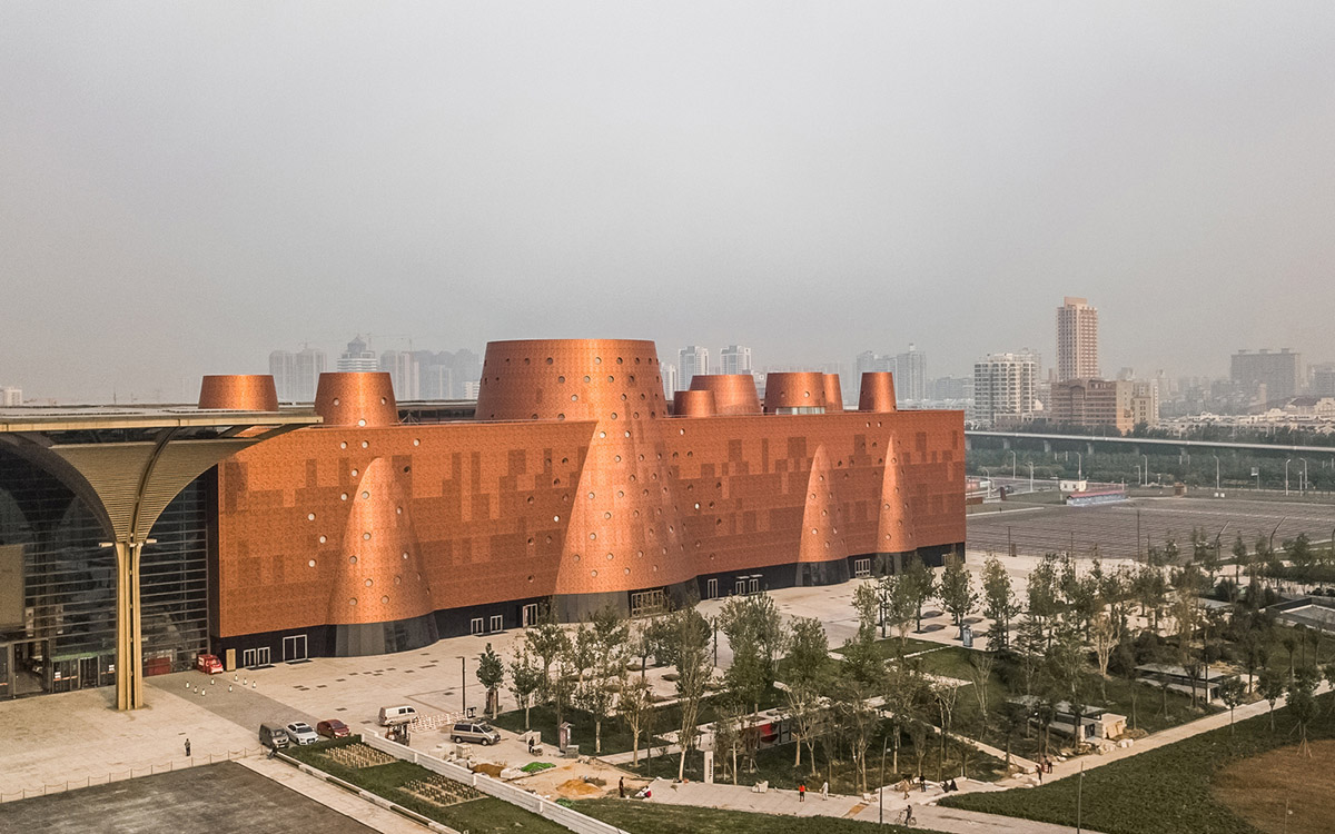 Bernard Tschumi's Exploratorium features copper-clad cones addressing Tianjin's industrial past