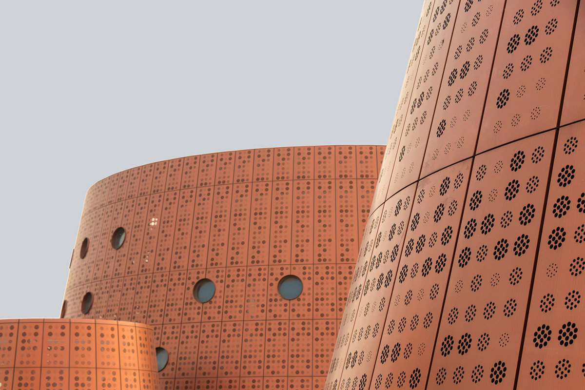 Bernard Tschumi's Exploratorium features copper-clad cones addressing Tianjin's industrial past