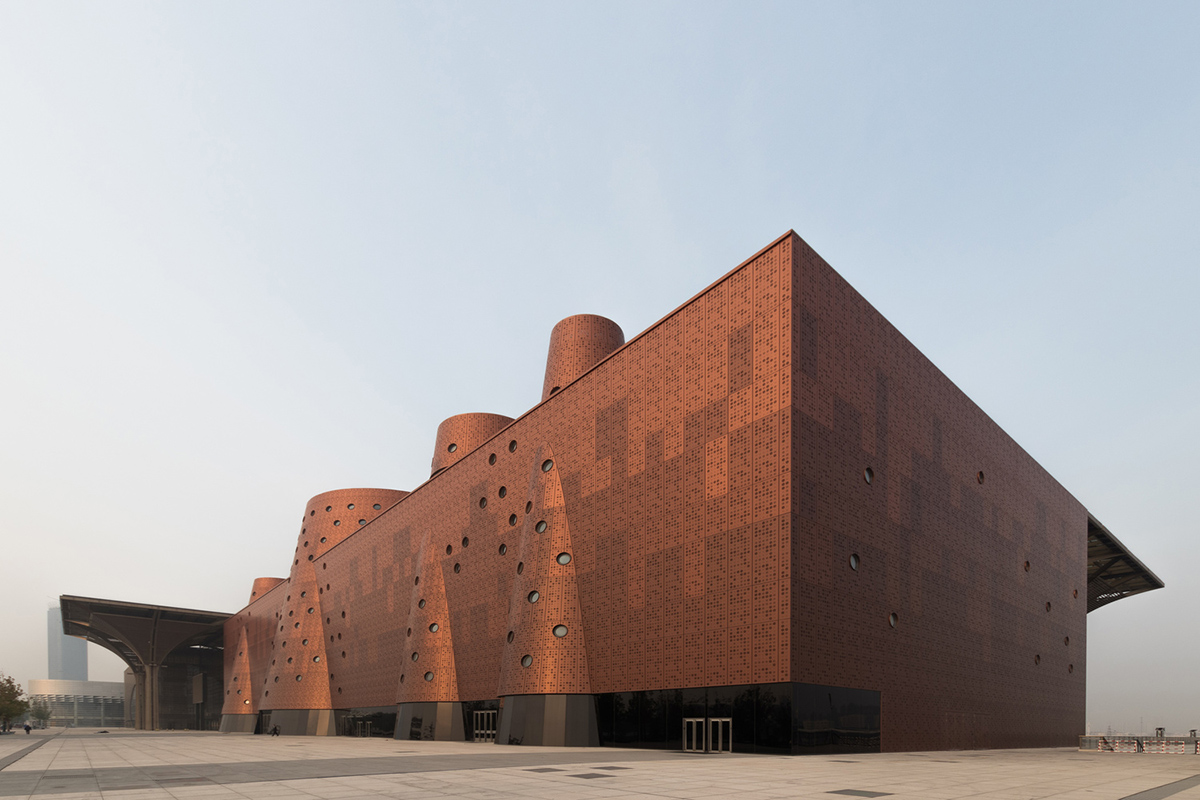 Bernard Tschumi's Exploratorium features copper-clad cones addressing Tianjin's industrial past