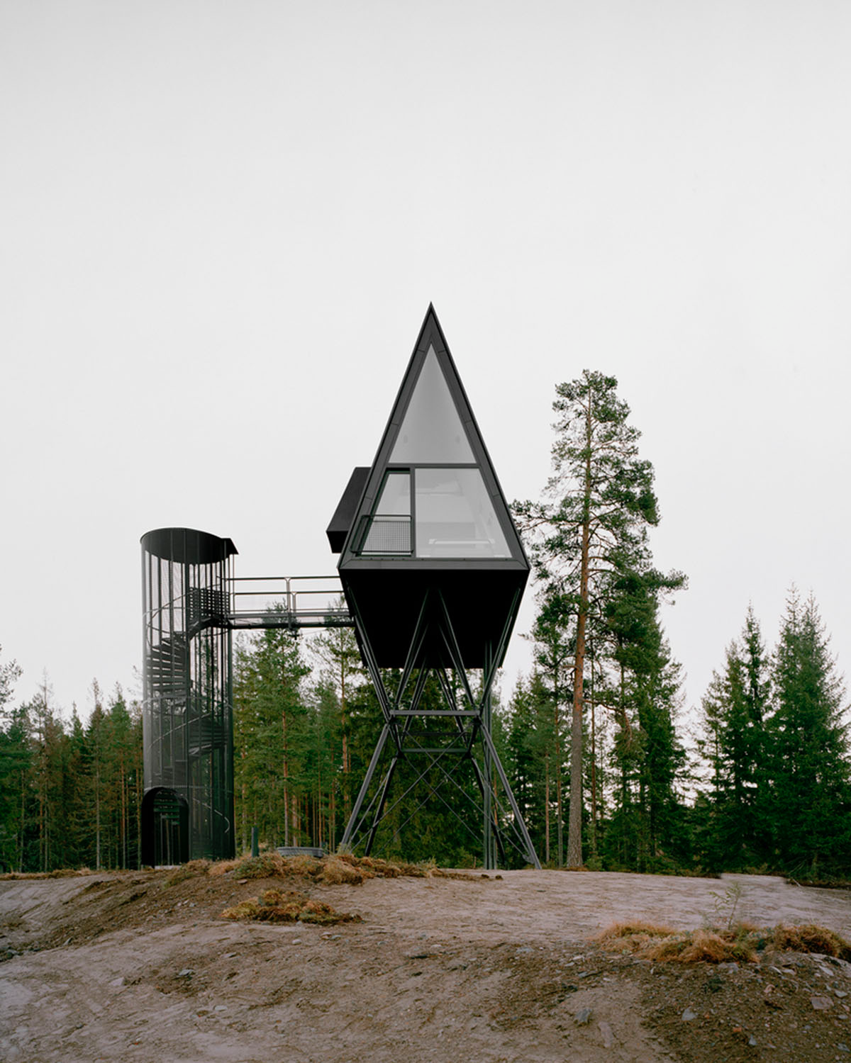 Espen Surnevik uses simple geometry for cabins raised on slim columns in forest area of Norway