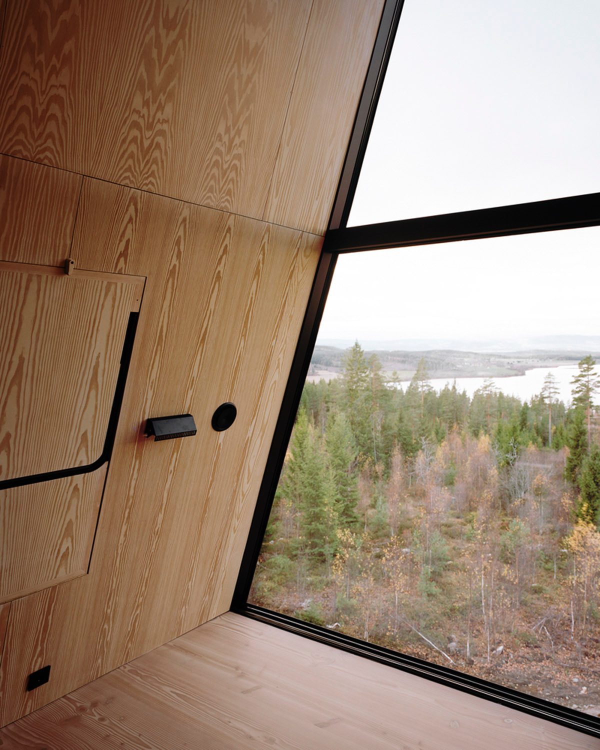 Espen Surnevik uses simple geometry for cabins raised on slim columns in forest area of Norway