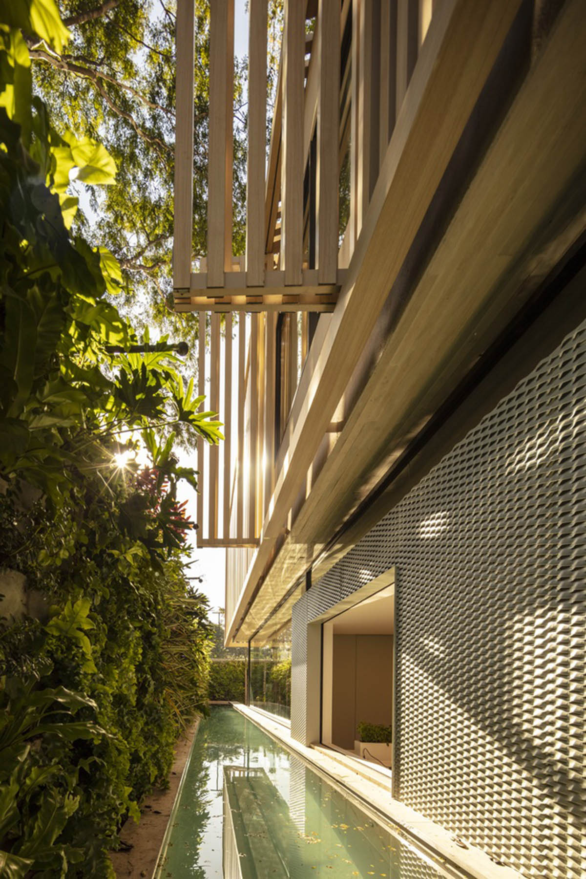 Studio AG designed large wooden residence featuring punctured volumes with gabled roof in São Paulo