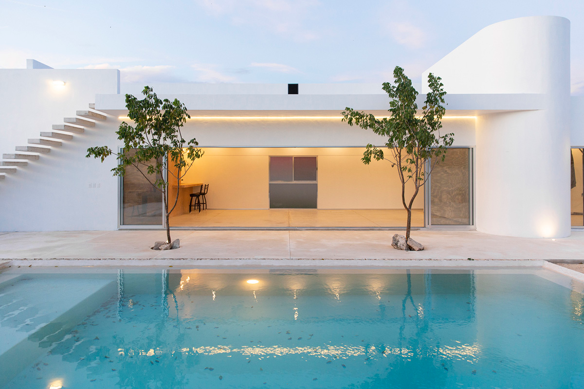 Garrido Lizarraga Arquitectos' white-coloured family house is enriched with cylindrical volumes