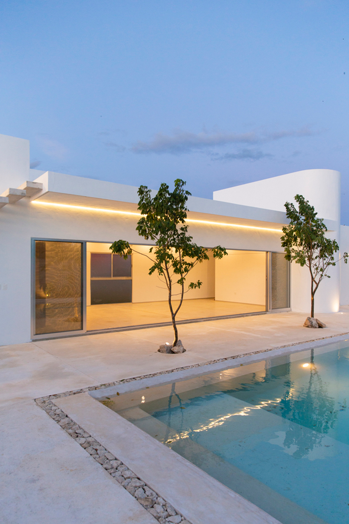 Garrido Lizarraga Arquitectos' white-coloured family house is enriched with cylindrical volumes