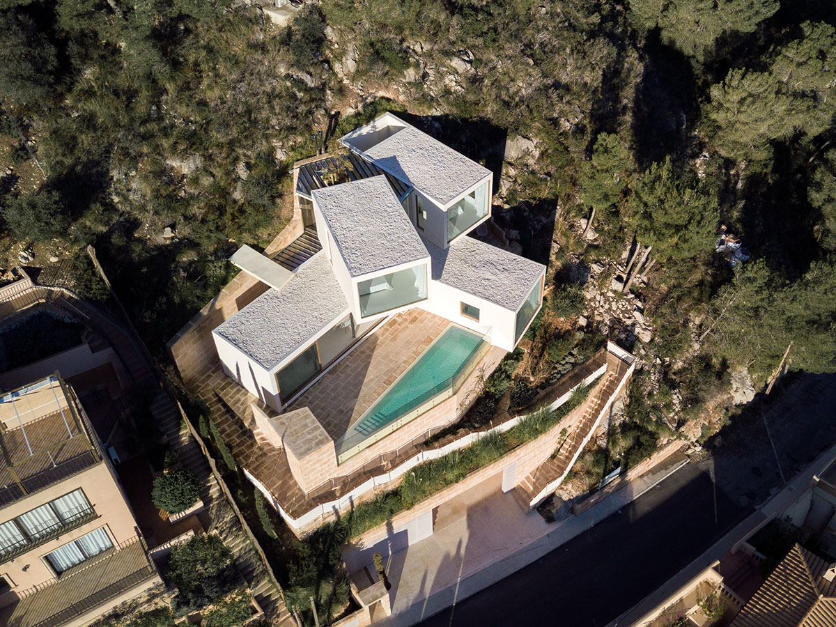 Caballero Colon Architects' house features protruding volumes giving different views to Canyamel Bay