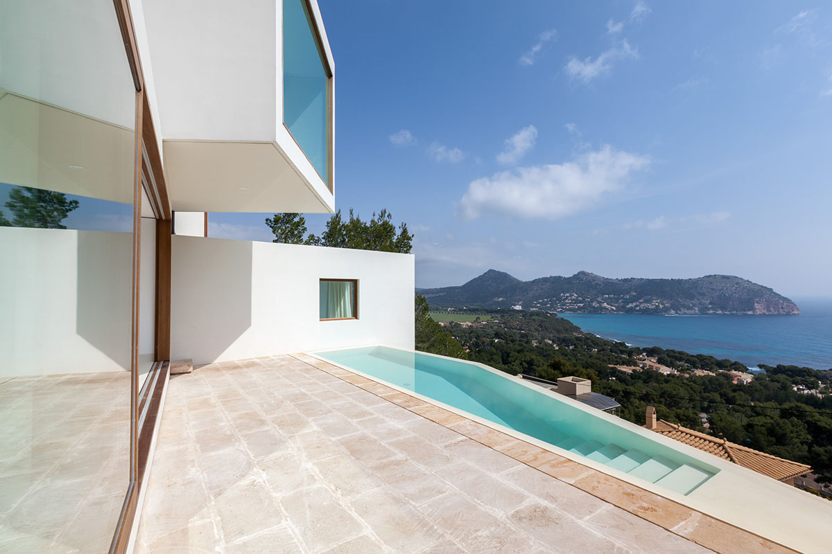 Caballero Colon Architects' house features protruding volumes giving different views to Canyamel Bay