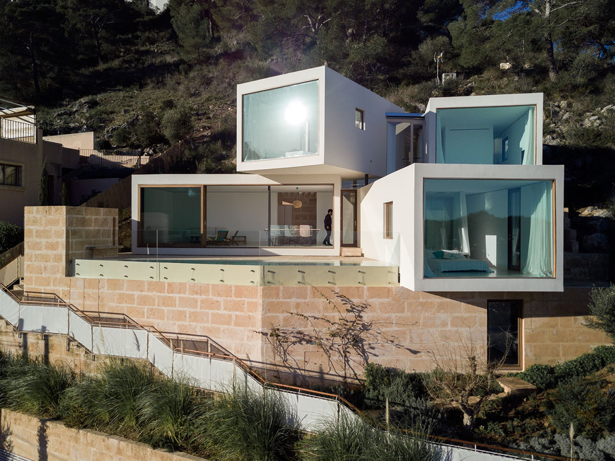 Caballero Colon Architects' house features protruding volumes giving different views to Canyamel Bay