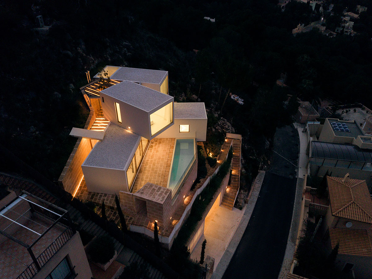 Caballero Colon Architects' house features protruding volumes giving different views to Canyamel Bay