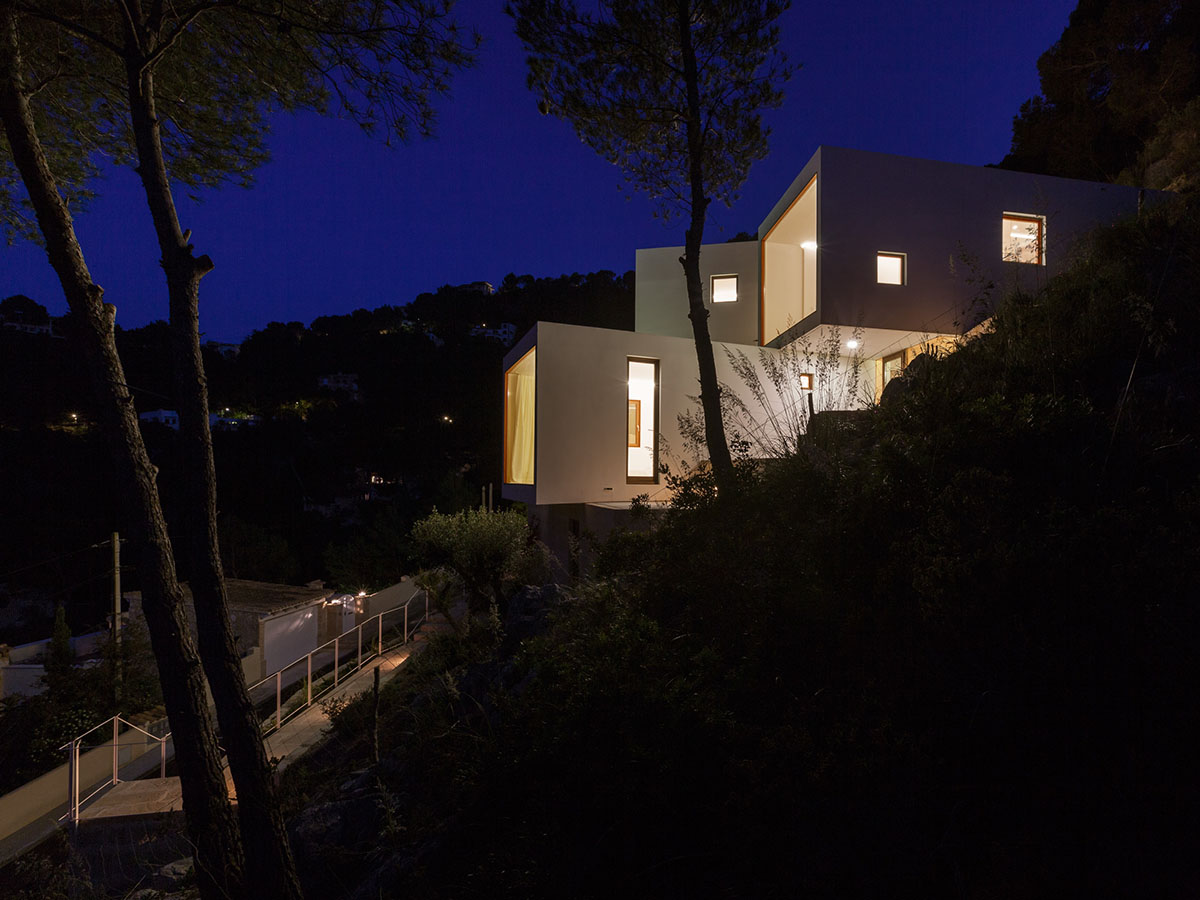 Caballero Colon Architects' house features protruding volumes giving different views to Canyamel Bay