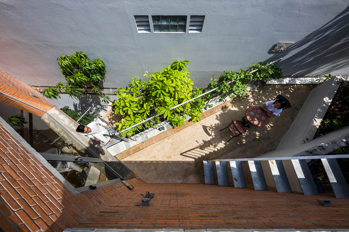 VTN Architects' new cascading family house creates large green gardens in a narrow site of Vietnam