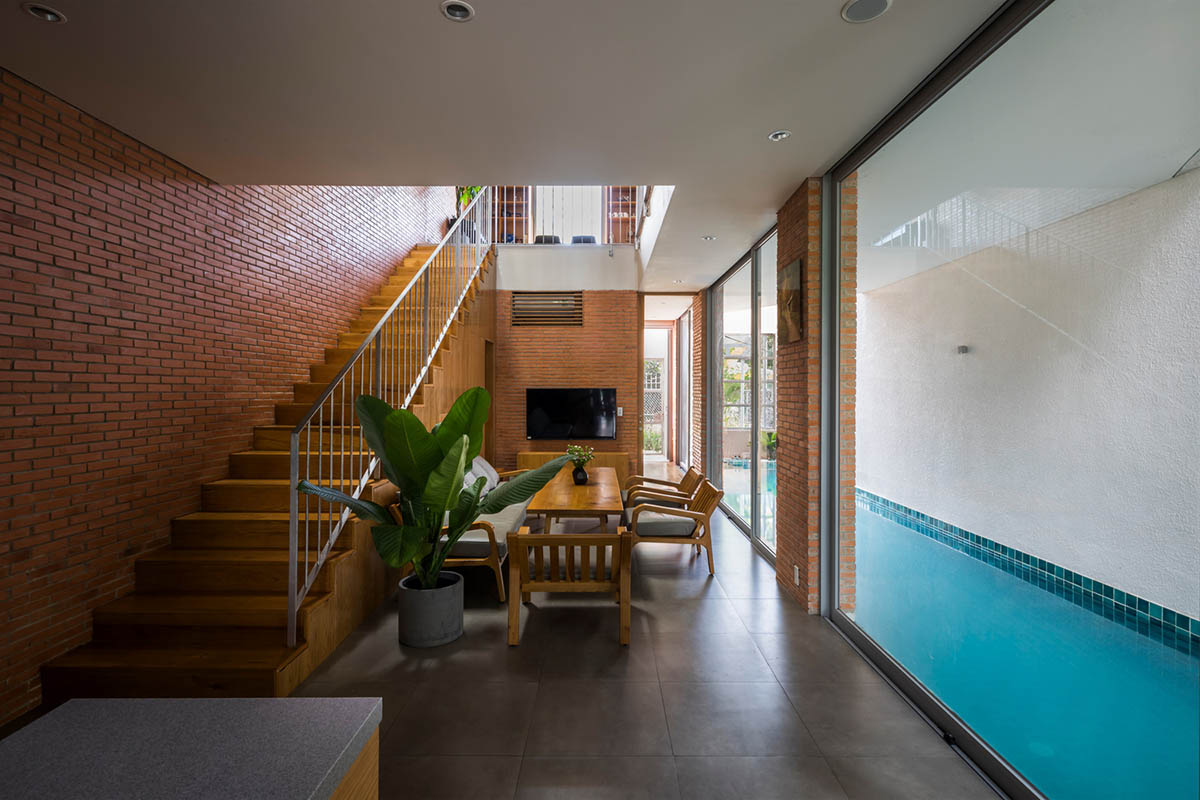 VTN Architects' new cascading family house creates large green gardens in a narrow site of Vietnam