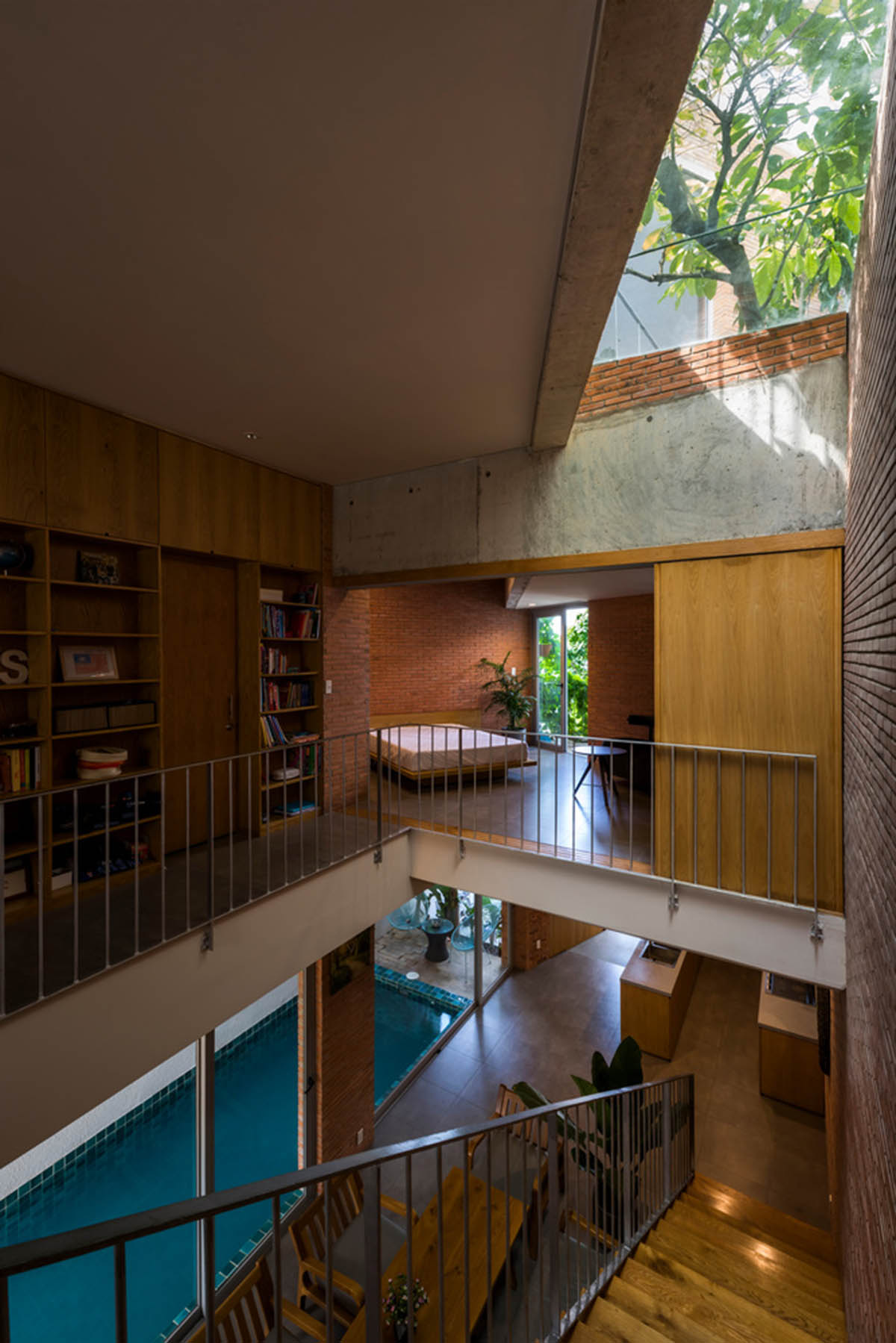 VTN Architects' new cascading family house creates large green gardens in a narrow site of Vietnam