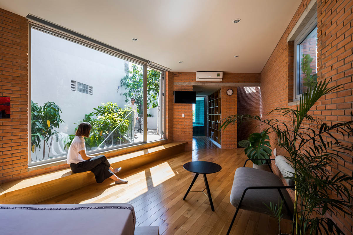VTN Architects' new cascading family house creates large green gardens in a narrow site of Vietnam