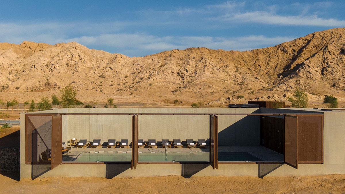 Anarchitect nestles this earth color hotel and spa building into the prehistoric of UAE