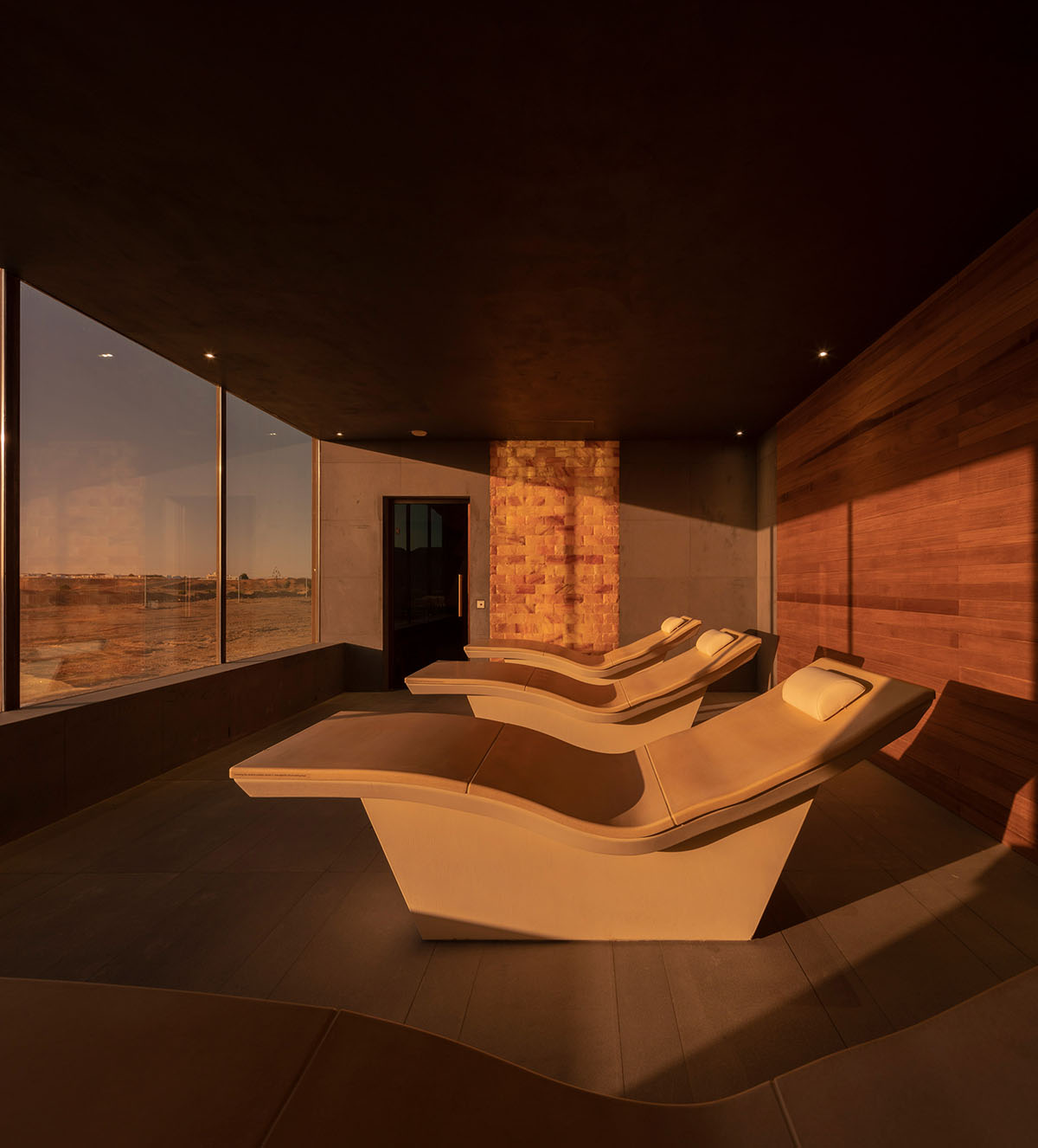 Anarchitect nestles this earth color hotel and spa building into the prehistoric of UAE