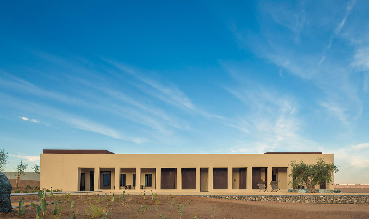 Anarchitect nestles this earth color hotel and spa building into the prehistoric of UAE