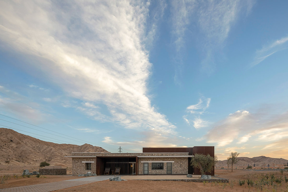 Anarchitect nestles this earth color hotel and spa building into the prehistoric of UAE