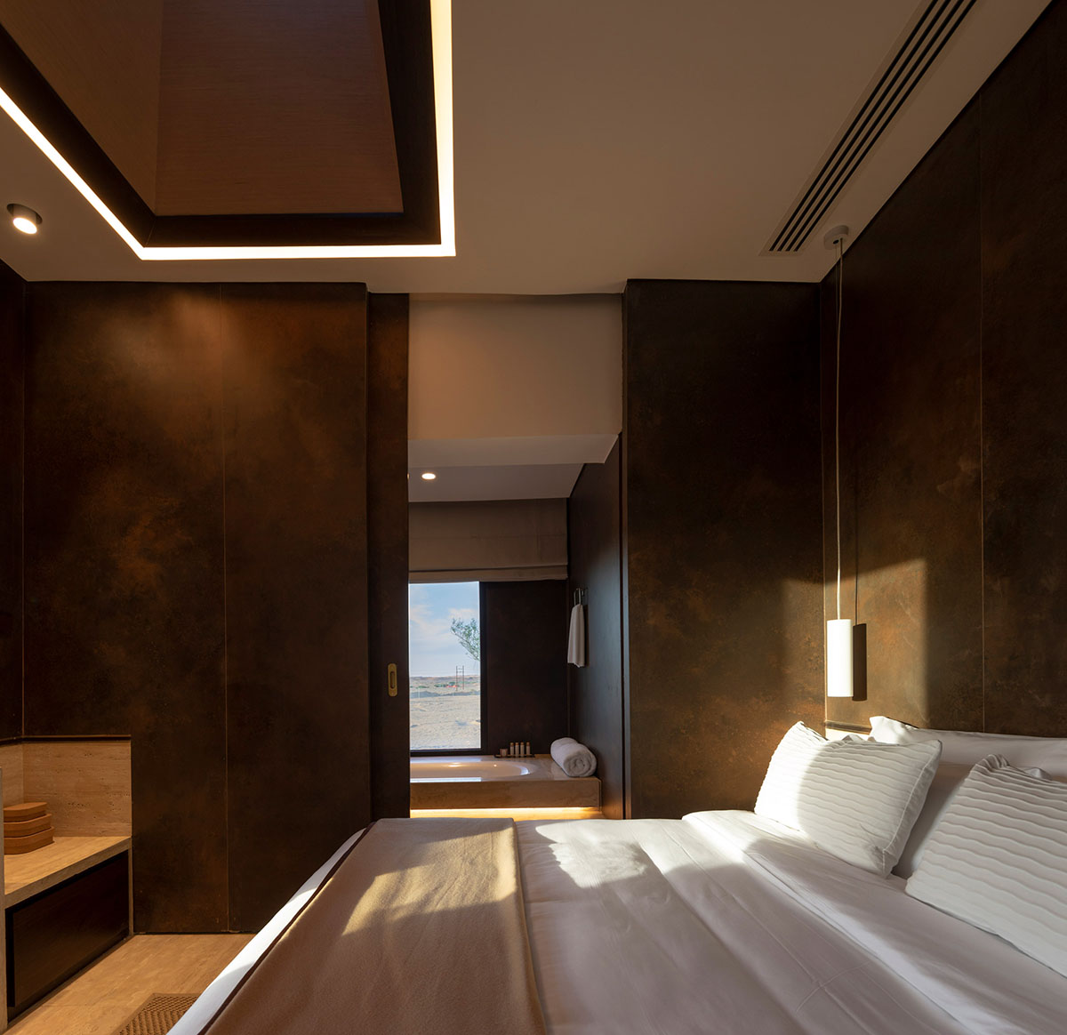 Anarchitect nestles this earth color hotel and spa building into the prehistoric of UAE